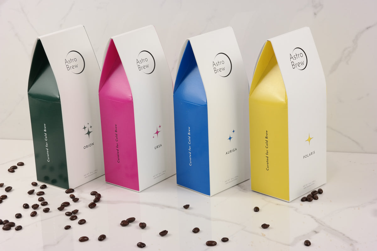 Orion, Ursa, Auriga, and Polaris AstroBrew coffee bags arranged on a marble counter